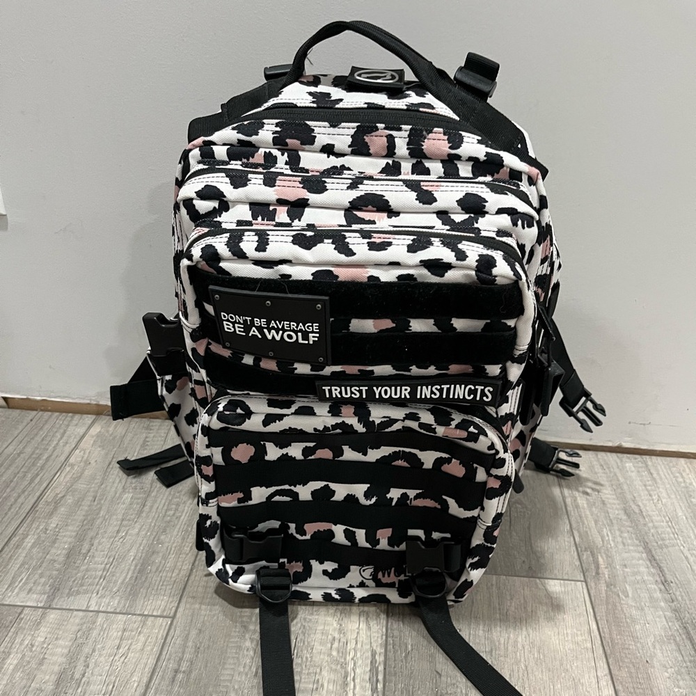 WOLFPACK Women's Black and Pink Patterned Backpack